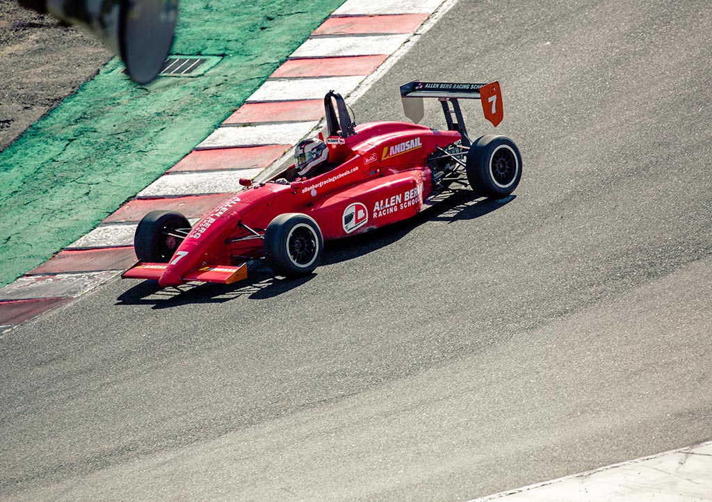Red racing car on track