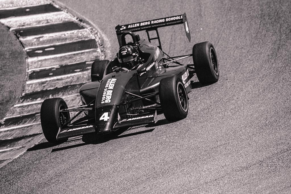 Formula one car on track grayscale