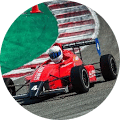 Red color f1 racing car on track