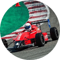 Red color f1 racing car on track