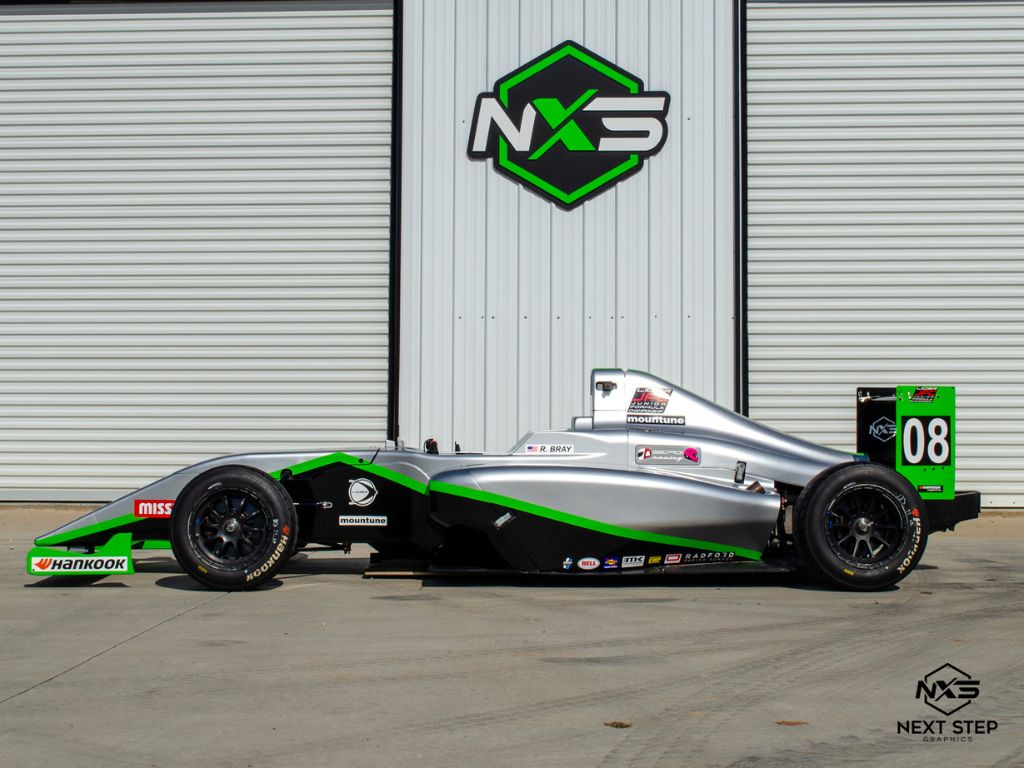 Next Step Graphics &Amp; Signs Joins Berg Racing As Official Sponsor 2 Berg racing formula 4 car featuring custom next step graphics wrap showcasing official sponsorship partnership