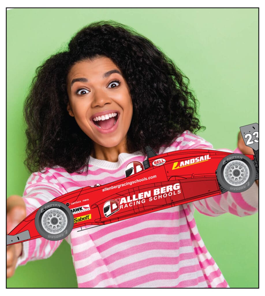 Top 10 Reasons To Send Mom To Allen Berg Racing Schools 1 Smiling mom holding allen berg's racing car