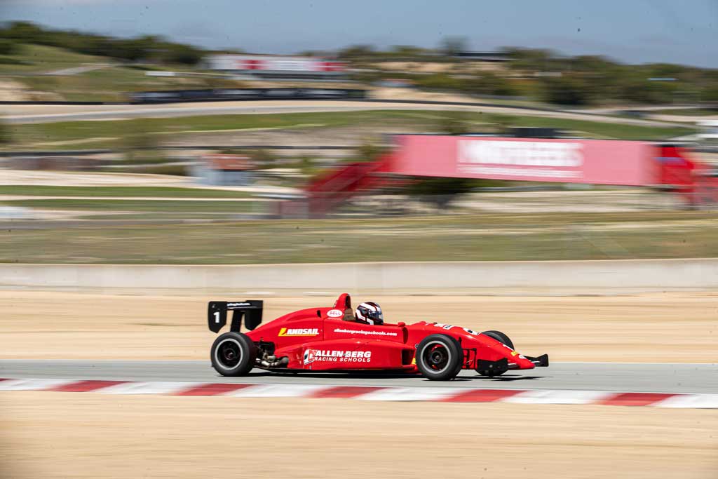 Red formula racing car blurred shot